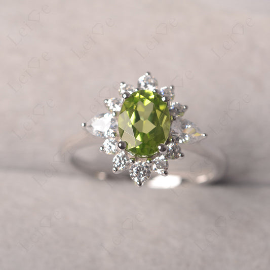 Oval Cut Peridot Ring With Pear Side Stone