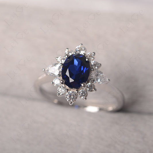 Oval Cut Sapphire Ring With Pear Side Stone