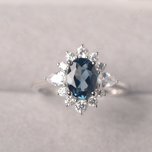Oval Cut London Blue Topaz Ring With Pear Side Stone