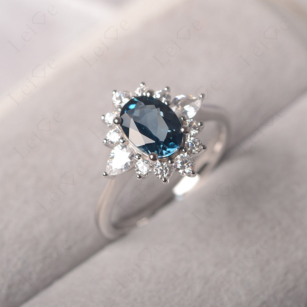 Oval Cut London Blue Topaz Ring With Pear Side Stone