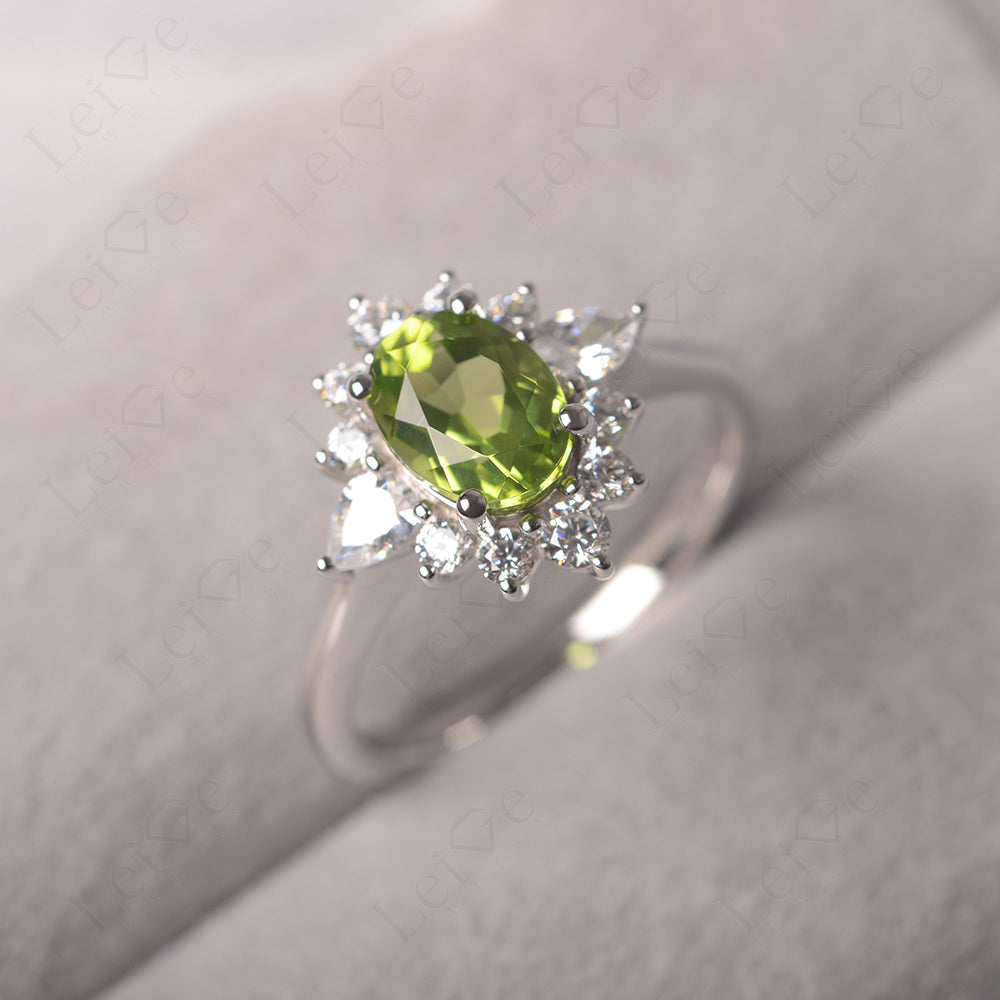 Oval Cut Peridot Ring With Pear Side Stone