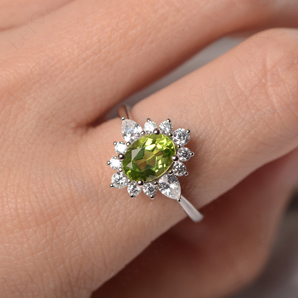Oval Cut Peridot Ring With Pear Side Stone
