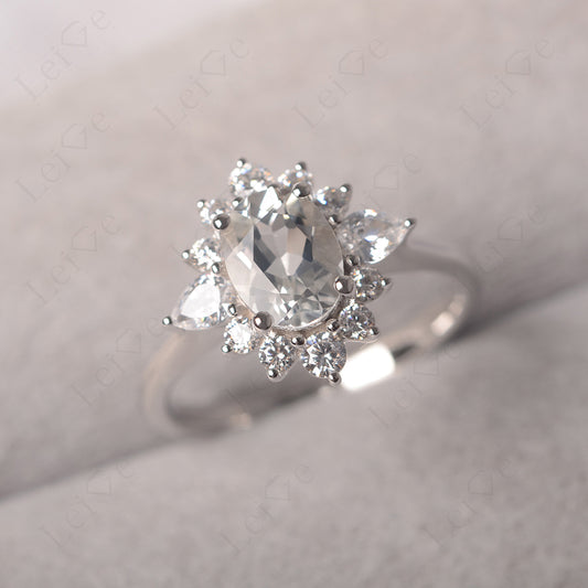 Oval Cut White Topaz Ring With Pear Side Stone
